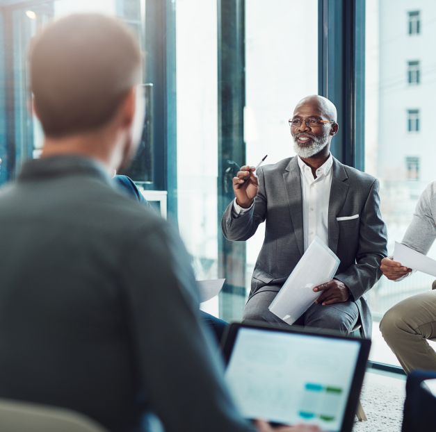 Presenter talking to researchers